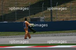 05.06.2009 Istanbul, Turkey,  Marshall's take away fake grass from the side of the track after it came lose causing the sesion to be red flagged - Formula 1 World Championship, Rd 7, Turkish Grand Prix, Friday Practice