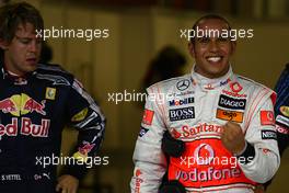 31.10.2009 Abu Dhabi, United Arab Emirates,  Sebastian Vettel (GER), Red Bull Racing with pole position man Lewis Hamilton (GBR), McLaren Mercedes - Formula 1 World Championship, Rd 17, Abu Dhabi Grand Prix, Saturday Qualifying