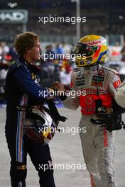 31.10.2009 Abu Dhabi, United Arab Emirates,  Sebastian Vettel (GER), Red Bull Racing shakes hands with pole position man Lewis Hamilton (GBR), McLaren Mercedes - Formula 1 World Championship, Rd 17, Abu Dhabi Grand Prix, Saturday Qualifying