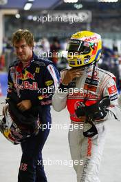 31.10.2009 Abu Dhabi, United Arab Emirates,  Sebastian Vettel (GER), Red Bull Racing with pole position man Lewis Hamilton (GBR), McLaren Mercedes - Formula 1 World Championship, Rd 17, Abu Dhabi Grand Prix, Saturday Qualifying