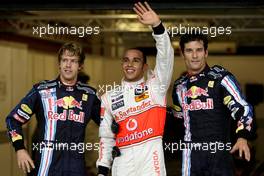 31.10.2009 Abu Dhabi, United Arab Emirates,  Sebastian Vettel (GER), Red Bull Racing, Lewis Hamilton (GBR), McLaren Mercedes in pole position and Mark Webber (AUS), Red Bull Racing - Formula 1 World Championship, Rd 17, Abu Dhabi Grand Prix, Saturday Qualifying