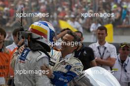 14.06.2009 Le Mans, France, Race winner Marc Gene celebrates with Serge Saulnier - 24 Hour of Le Mans 2009, Podium