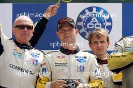 14.06.2009 Le Mans, France, LMGT1 podium: class winners Jan Magnussen and Antonio Garcia - 24 Hour of Le Mans 2009, Podium