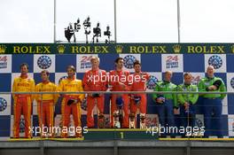 14.06.2009 Le Mans, France, LMGT2 podium: class winners Jaime Melo, Pierre Kaffer and Mika Salo, second place Fabio Babini, Matteo Malucelli and Paolo Ruberti, third place Tracy Krohn, Nic Jonsson and Eric van de Poele - 24 Hour of Le Mans 2009, Podium