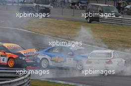 06.09.2009 Oschersleben, Germany, Jordi Gene (ESP), SEAT Sport, SEAT Leon 2.0 TDI crash with Robert Huff (GBR), Chevrolet, Chevrolet Cruze and Jörg Müller (GER),  BMW Team Germany, BMW 320si - WTCC, Germany, Oschersleben, Rd. 17-18