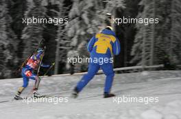 01.12.2010, Oestersund, Sweden (SWE): Anna Carin Zidek (SWE), Salomon, Leki, adidas and Wolfgang Pichler (GER), coach Sweden - IBU world cup biathlon, individual women, Oestersund (SWE). www.xpb.cc. © Manzoni/xpb.cc. Every downloaded picture is fee-liable.