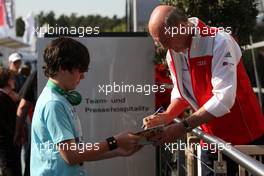 23.04.2010 Hockenheim, Germany,  Dr. Ullrich (AUT) signing autographs. - DTM 2010 at Hockenheimring, Hockenheim, Germany