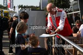 23.04.2010 Hockenheim, Germany,  Dr. Ullrich (AUT) , motorsport directer Audi signing autographs for the kids in the paddock. - DTM 2010 at Hockenheimring, Hockenheim, Germany