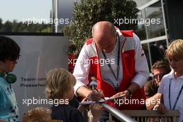 23.04.2010 Hockenheim, Germany,  Dr. Ullrich ( AUT) , motorsport director of Audi signing autographs. - DTM 2010 at Hockenheimring, Hockenheim, Germany