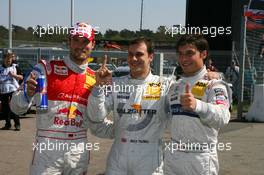 24.04.2010 Hockenheim, Germany,  Top three from qualifying: Gary Paffett (GBR), Team HWA AMG Mercedes, Portrait (1st, center), Martin Tomczyk (GER), Audi Sport Team Abt, Portrait (2nd, left), Bruno Spengler (CAN), Team HWA AMG Mercedes, Portrait (3rd, right) - DTM 2010 at Hockenheimring, Hockenheim, Germany