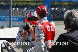 24.04.2010 Hockenheim, Germany,  Martin Tomczyk (GER), Audi Sport Team Abt (2nd) congratulates Gary Paffett (GBR), Team HWA AMG Mercedes, with his pole position in qualifying - DTM 2010 at Hockenheimring, Hockenheim, Germany