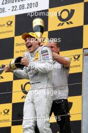 22.08.2010 Zandvoort, The Netherlands,  Racewinner Gary Paffett (GBR), Team HWA AMG Mercedes, AMG Mercedes C-Klasse receives a champagne shower on the podium after his victory. - DTM 2010 at Circuit Park Zandvoort, The Netherlands