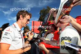 26.03.2010 Melbourne, Australia,  Jenson Button (GBR), McLaren Mercedes Signing autographs,  - Formula 1 World Championship, Rd 2, Australian Grand Prix, Friday
