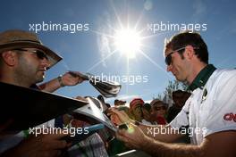 26.03.2010 Melbourne, Australia,  Jarno Trulli (ITA), Lotus F1 Team, Signing autographs,  - Formula 1 World Championship, Rd 2, Australian Grand Prix, Friday