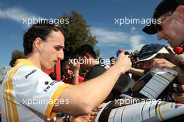 26.03.2010 Melbourne, Australia,  Robert Kubica (POL), Renault F1 Team, Signing autographs,  - Formula 1 World Championship, Rd 2, Australian Grand Prix, Friday