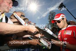 26.03.2010 Melbourne, Australia,  Felipe Massa (BRA), Scuderia Ferrari, Signing autographs,  - Formula 1 World Championship, Rd 2, Australian Grand Prix, Friday
