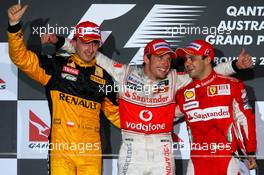 28.03.2010 Melbourne, Australia,  2nd place Robert Kubica (POL), Renault F1 Team with 1st place Jenson Button (GBR), McLaren Mercedes and 3rd place Felipe Massa (BRA), Scuderia Ferrari - Formula 1 World Championship, Rd 2, Australian Grand Prix, Sunday Podium