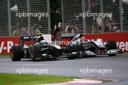 28.03.2010 Melbourne, Australia,  Heikki Kovalainen (FIN), Lotus F1 Team and Michael Schumacher (GER), Mercedes GP  - Formula 1 World Championship, Rd 2, Australian Grand Prix, Sunday Race