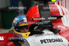 27.03.2010 Melbourne, Australia,  Michael Schumacher (GER), Mercedes GP talks to Fernando Alonso (ESP), Scuderia Ferrari  - Formula 1 World Championship, Rd 2, Australian Grand Prix, Saturday Qualifying