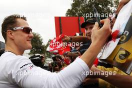 28.03.2010 Melbourne, Australia,  Michael Schumacher (GER), Mercedes GP Petronas signing autographs - Formula 1 World Championship, Rd 2, Australian Grand Prix, Sunday