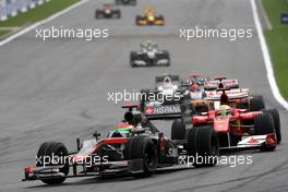 29.08.2010 Spa, Belgium,  Sakon Yamamoto (JPN), Hispania Racing F1 Team HRT leads Felipe Massa (BRA), Scuderia Ferrari - Formula 1 World Championship, Rd 13, Belgium Grand Prix, Sunday Race