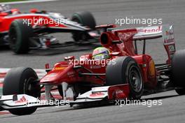 29.08.2010 Spa, Belgium,  Felipe Massa (BRA), Scuderia Ferrari leads Timo Glock (GER), Virgin Racing - Formula 1 World Championship, Rd 13, Belgium Grand Prix, Sunday Race