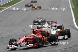 29.08.2010 Spa, Belgium,  Felipe Massa (BRA), Scuderia Ferrari leads Adrian Sutil (GER), Force India F1 Team - Formula 1 World Championship, Rd 13, Belgium Grand Prix, Sunday Race