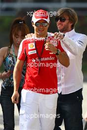 12.03.2010 Sakhir, Bahrain,  Felipe Massa (BRA), Scuderia Ferrari and Nick Heidfeld (GER), Test Driver, Mercedes GP Petronas - Formula 1 World Championship, Rd 1, Bahrain Grand Prix, Friday