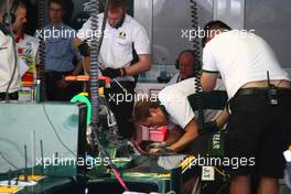 12.03.2010 Sakhir, Bahrain,  Lotus working hard on their car - Formula 1 World Championship, Rd 1, Bahrain Grand Prix, Friday
