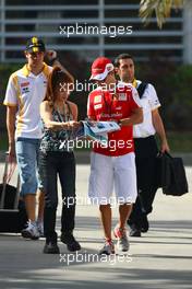 12.03.2010 Sakhir, Bahrain,  Felipe Massa (BRA), Scuderia Ferrari signing an autograph - Formula 1 World Championship, Rd 1, Bahrain Grand Prix, Friday