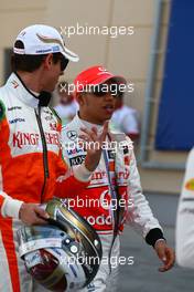 12.03.2010 Sakhir, Bahrain,  Adrian Sutil (GER), Force India F1 Team and Lewis Hamilton (GBR), McLaren Mercedes - Formula 1 World Championship, Rd 1, Bahrain Grand Prix, Friday