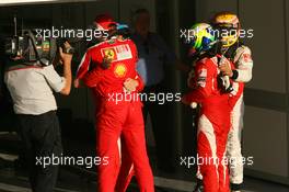 14.03.2010 Sakhir, Bahrain,  2nd place Felipe Massa (BRA), Scuderia Ferrari with 1st place Fernando Alonso (ESP), Scuderia Ferrari, Stefano Domenicali (ITA) Ferrari General Director and 3rd place Lewis Hamilton (GBR), McLaren Mercedes - Formula 1 World Championship, Rd 1, Bahrain Grand Prix, Sunday Podium