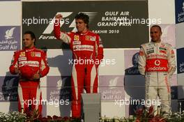 14.03.2010 Sakhir, Bahrain,  2nd place Felipe Massa (BRA), Scuderia Ferrari witht 1st place Fernando Alonso (ESP), Scuderia Ferrari and 3rd place Lewis Hamilton (GBR), McLaren Mercedes - Formula 1 World Championship, Rd 1, Bahrain Grand Prix, Sunday Podium