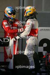 14.03.2010 Sakhir, Bahrain,  Fernando Alonso (ESP), Scuderia Ferrari and Lewis Hamilton (GBR), McLaren Mercedes  - Formula 1 World Championship, Rd 1, Bahrain Grand Prix, Sunday Podium