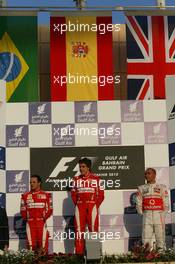 14.03.2010 Sakhir, Bahrain,  Felipe Massa (BRA), Scuderia Ferrari with Fernando Alonso (ESP), Scuderia Ferrari and Lewis Hamilton (GBR), McLaren Mercedes - Formula 1 World Championship, Rd 1, Bahrain Grand Prix, Sunday Podium