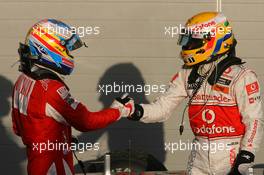 14.03.2010 Sakhir, Bahrain,  Fernando Alonso (ESP), Scuderia Ferrari and Lewis Hamilton (GBR), McLaren Mercedes - Formula 1 World Championship, Rd 1, Bahrain Grand Prix, Sunday Podium