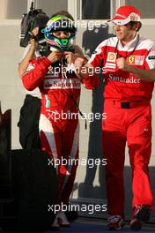 14.03.2010 Sakhir, Bahrain,  Felipe Massa (BRA), Scuderia Ferrari and Stefano Domenicali (ITA), Scuderia Ferrari Sporting Director  - Formula 1 World Championship, Rd 1, Bahrain Grand Prix, Sunday Podium