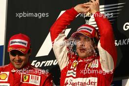 14.03.2010 Sakhir, Bahrain,  Fernando Alonso (ESP), Scuderia Ferrari and Felipe Massa (BRA), Scuderia Ferrari  - Formula 1 World Championship, Rd 1, Bahrain Grand Prix, Sunday Podium