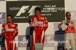 14.03.2010 Sakhir, Bahrain,  Felipe Massa (BRA), Scuderia Ferrari and Fernando Alonso (ESP), Scuderia Ferrar, Lewis Hamilton (GBR), McLaren Mercedes i - Formula 1 World Championship, Rd 1, Bahrain Grand Prix, Sunday Podium