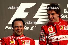 14.03.2010 Sakhir, Bahrain,  Felipe Massa (BRA), Scuderia Ferrari, Fernando Alonso (ESP), Scuderia Ferrari - Formula 1 World Championship, Rd 1, Bahrain Grand Prix, Sunday Podium
