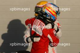 14.03.2010 Sakhir, Bahrain,  1st place Fernando Alonso (ESP), Scuderia Ferrari and Lewis Hamilton (GBR), McLaren Mercedes - Formula 1 World Championship, Rd 1, Bahrain Grand Prix, Sunday Podium