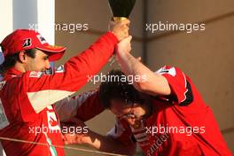 14.03.2010 Sakhir, Bahrain,  Felipe Massa (BRA), Scuderia Ferrari, Stefano Domenicali (ITA) Ferrari General Director - Formula 1 World Championship, Rd 1, Bahrain Grand Prix, Sunday Podium