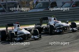 14.03.2010 Sakhir, Bahrain,  Pedro de la Rosa (ESP), BMW Sauber F1 Team and Kamui Kobayashi (JAP), BMW Sauber F1 Team  - Formula 1 World Championship, Rd 1, Bahrain Grand Prix, Sunday Race