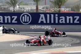 14.03.2010 Sakhir, Bahrain,  Fernando Alonso (ESP), Scuderia Ferrari, F10 leads Felipe Massa (BRA), Scuderia Ferrari, F10 - Formula 1 World Championship, Rd 1, Bahrain Grand Prix, Sunday Race