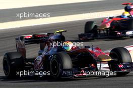 14.03.2010 Sakhir, Bahrain,  Jaime Alguersuari (ESP), Scuderia Toro Rosso, STR05 leads Sébastien Buemi (SUI), Scuderia Toro Rosso, STR05 - Formula 1 World Championship, Rd 1, Bahrain Grand Prix, Sunday Race