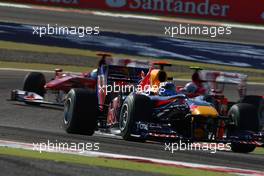 14.03.2010 Sakhir, Bahrain,  Sebastian Vettel (GER), Red Bull Racing, RB6 leads the start of the race - Formula 1 World Championship, Rd 1, Bahrain Grand Prix, Sunday Race