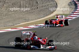 14.03.2010 Sakhir, Bahrain,  Fernando Alonso (ESP), Scuderia Ferrari, F10 leads Felipe Massa (BRA), Scuderia Ferrari, F10 - Formula 1 World Championship, Rd 1, Bahrain Grand Prix, Sunday Race