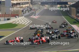 14.03.2010 Sakhir, Bahrain,  Start of the race, Fernando Alonso (ESP), Scuderia Ferrari and Felipe Massa (BRA), Scuderia Ferrari  - Formula 1 World Championship, Rd 1, Bahrain Grand Prix, Sunday Race