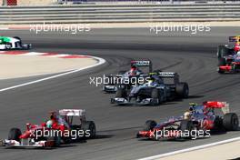 14.03.2010 Sakhir, Bahrain,  Felipe Massa (BRA), Scuderia Ferrari, F10 leads Lewis Hamilton (GBR), McLaren Mercedes, MP4-25, Nico Rosberg (GER), Mercedes GP Petronas, W01, Michael Schumacher (GER), Mercedes GP Petronas, W01 - Formula 1 World Championship, Rd 1, Bahrain Grand Prix, Sunday Race