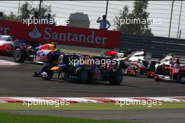 14.03.2010 Sakhir, Bahrain,  Sebastian Vettel (GER), Red Bull Racing, RB6 leads the start of the race - Formula 1 World Championship, Rd 1, Bahrain Grand Prix, Sunday Race